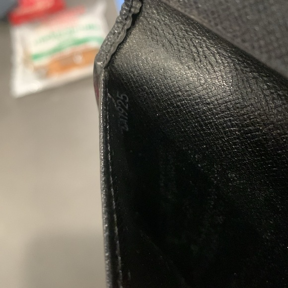 Authentic Louis Vuitton black epi long bifold wallet. Date code is CA1925 - Picture 5 of 8